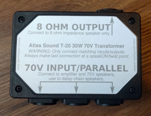 A birds-eye view of the transformer/splitter box with the custom top label clearly displayed